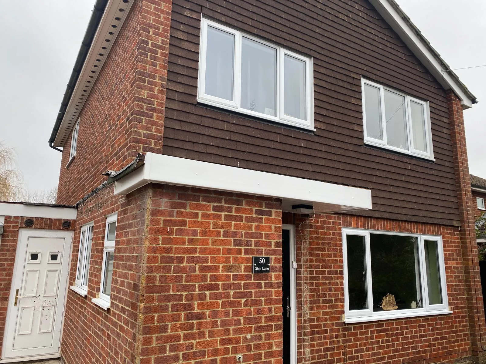 A house with a new porch canopy roof