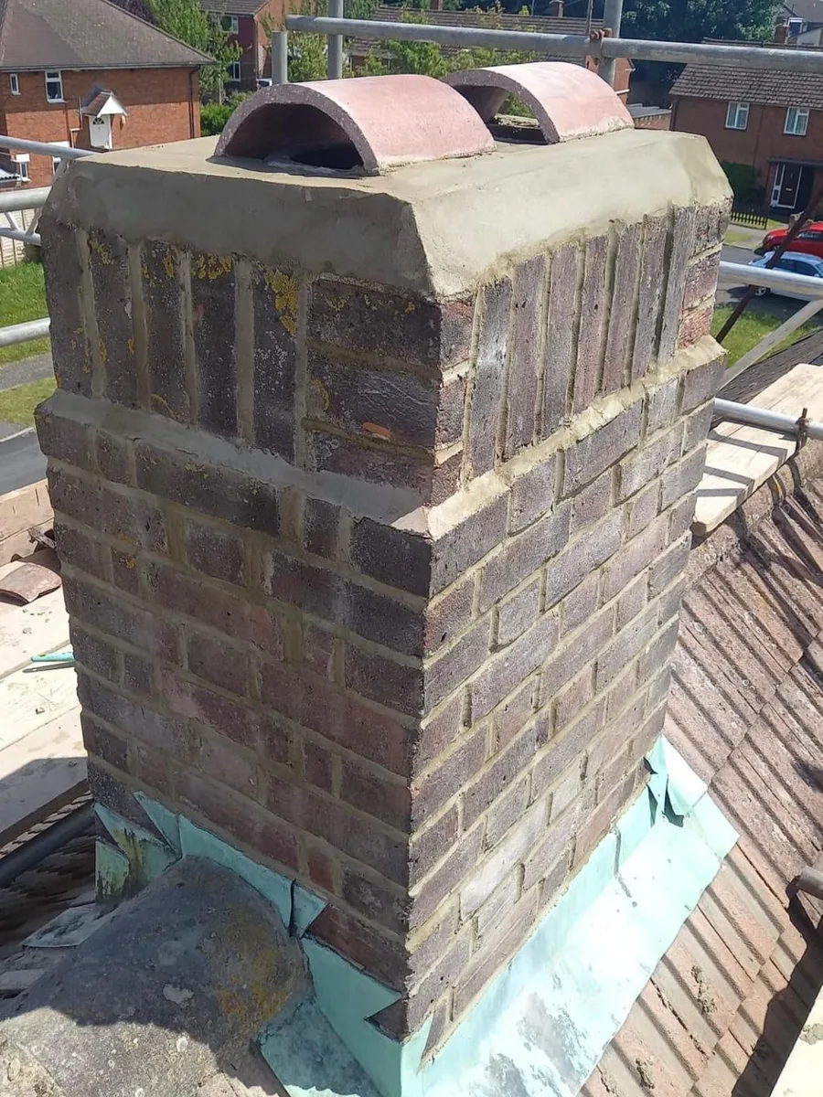 A chimney stack rebuilt with new lead flashing