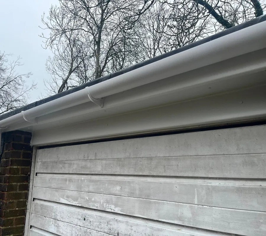 New white guttering along a garage roofline