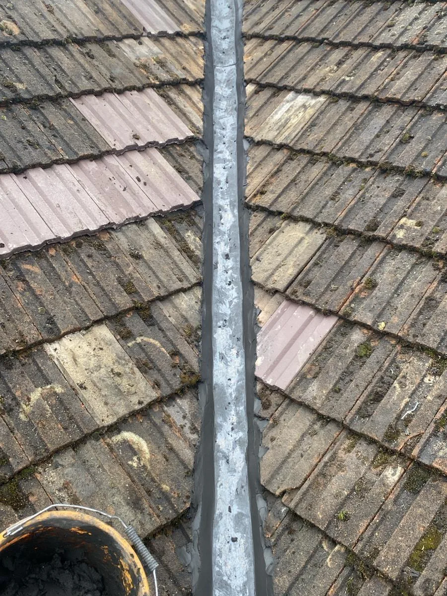 A new valley fitted between tiled roof slopes